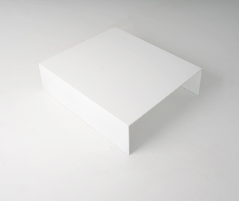 U shaped Table 1 made of solid aluminum plates coated in white. Table is low.
