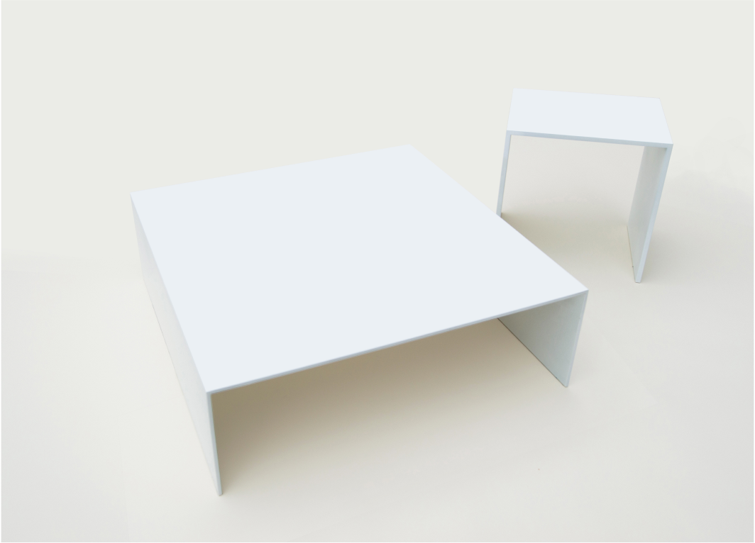 Two minimalist white tables have a square top with its sides forming right angles. The smaller table stands taller.