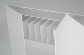 A close-up of the interior of a minimalist white sideboard. The doors are open, revealing several vertical dividers within one of the compartments. 