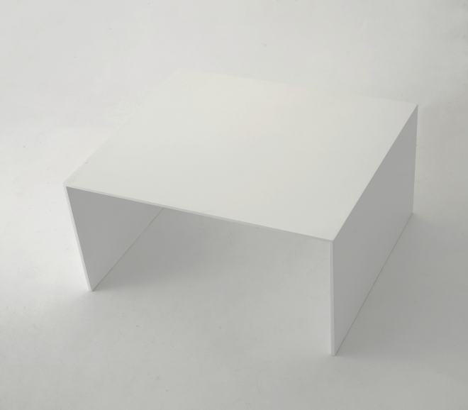 A wide overhead angle of a white rectangular table facing left. Single piece, bent at the edges to form a sharp U-shape.